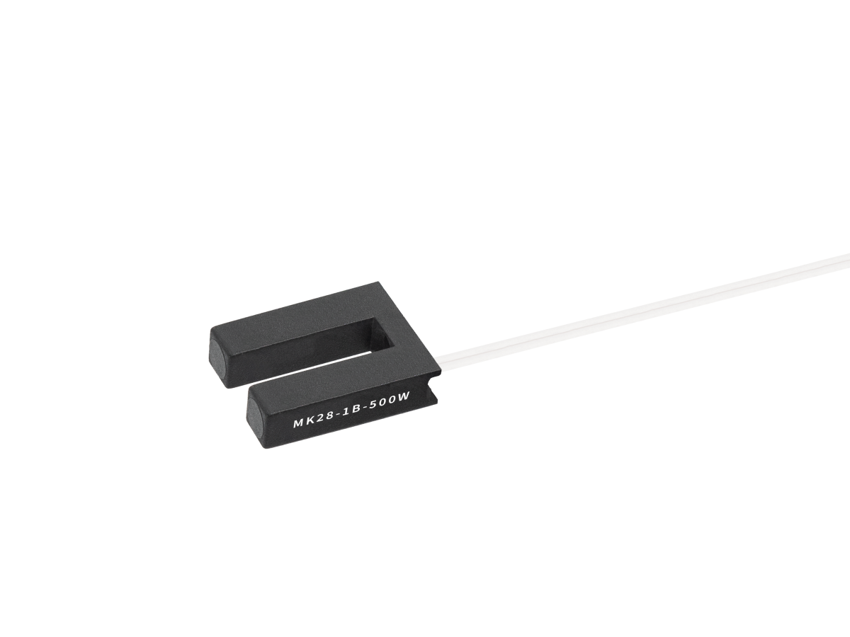 A black U-shaped MK28 Series reed sensor with white wires extending from one side. The sensor is labeled “MK28-1B-500W” in white text. The background is plain white. by Standex Detect