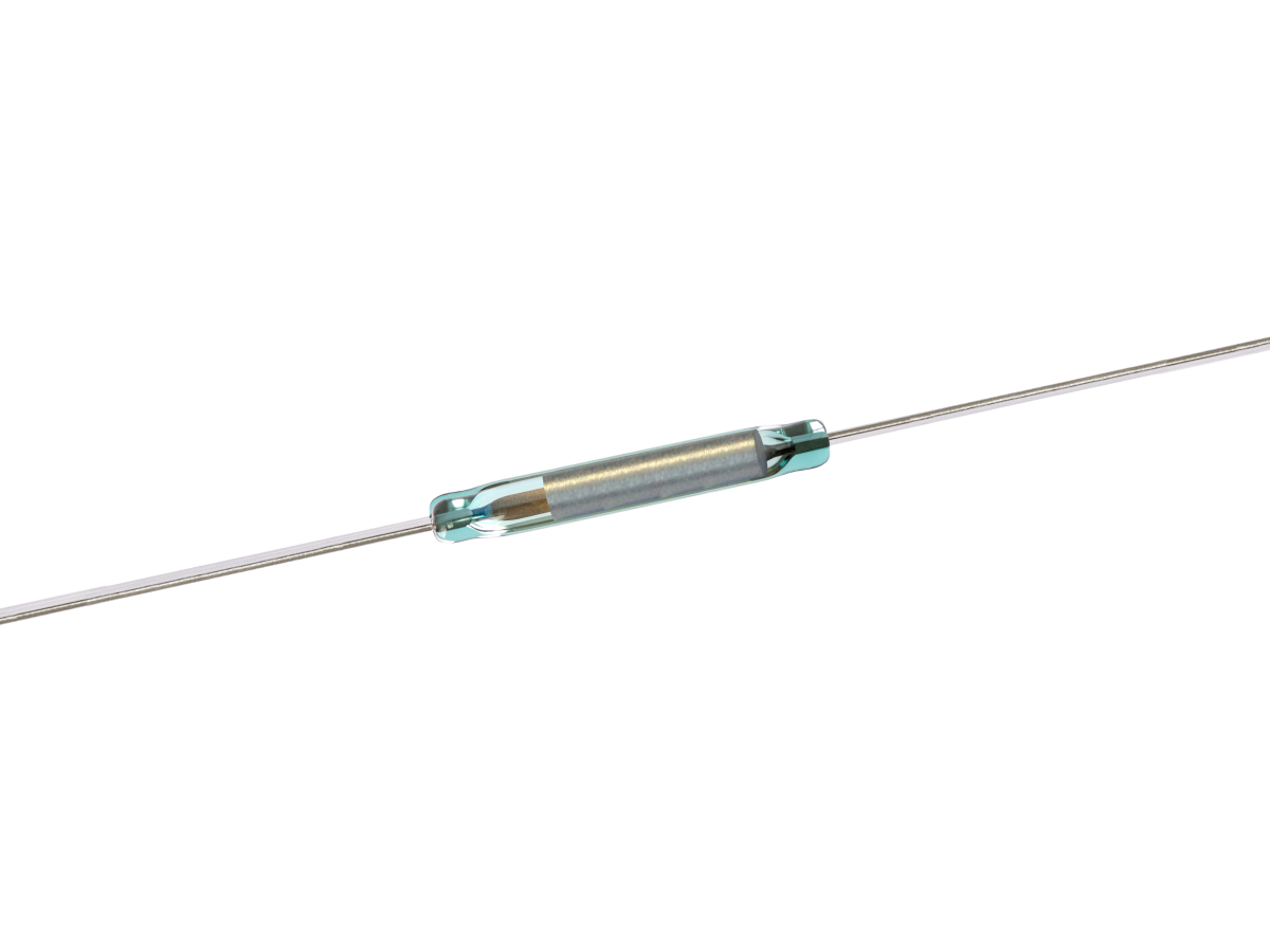 A close-up of a KSK-1E85 Reed Switch with metal leads extending from both ends, used as an electrical component for detecting magnetic fields in the Series. by Standex Detect