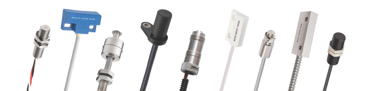 A row of various industrial sensors, each with different shapes, sizes, and connectors, displayed against a white background—ideal for data center sensor integration. by Standex Detect