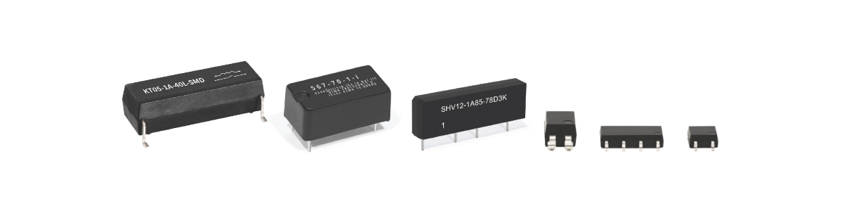 A row of five black electronic components of varying sizes and shapes, each with visible metal pins for circuit board mounting, ideal for data center sensor integration, displayed against a white background. by Standex Detect
