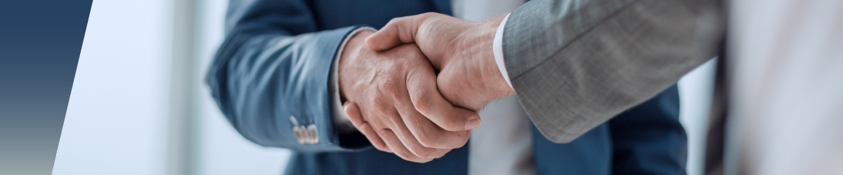Close-up of two people in business suits shaking hands, suggesting agreement or partnership in a professional setting—ideal for illustrating collaboration on High-Voltage Reed Relay Applications. by Standex Detect