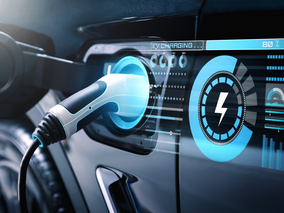 A close-up of an electric vehicle being charged, with a charging cable plugged in and a digital display showing charging progress and a battery icon at 80%, highlights the importance of precision sensing for motion systems to ensure accurate monitoring and efficient energy transfer. by Standex Detect